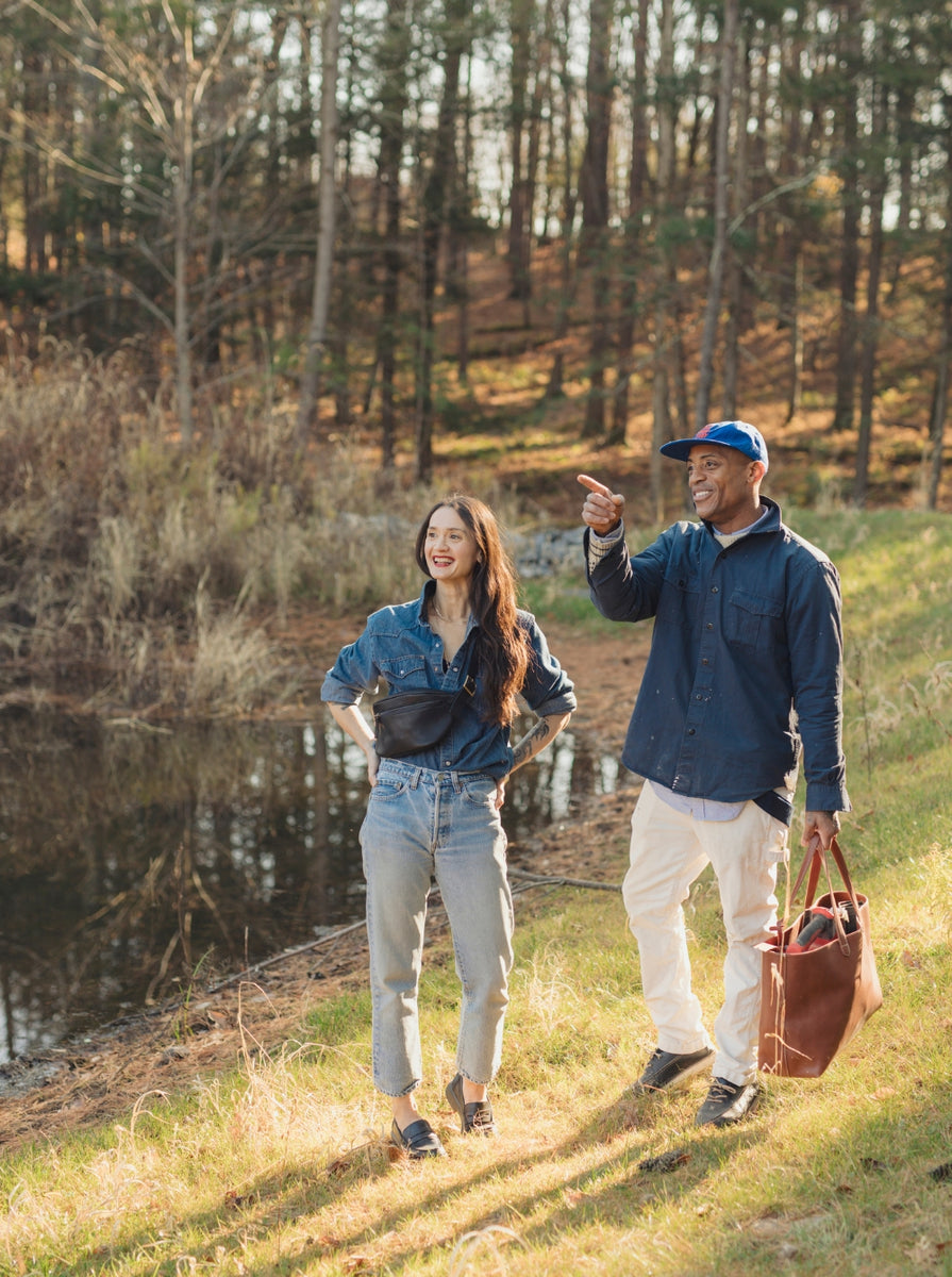 Man and woman standing by the lake