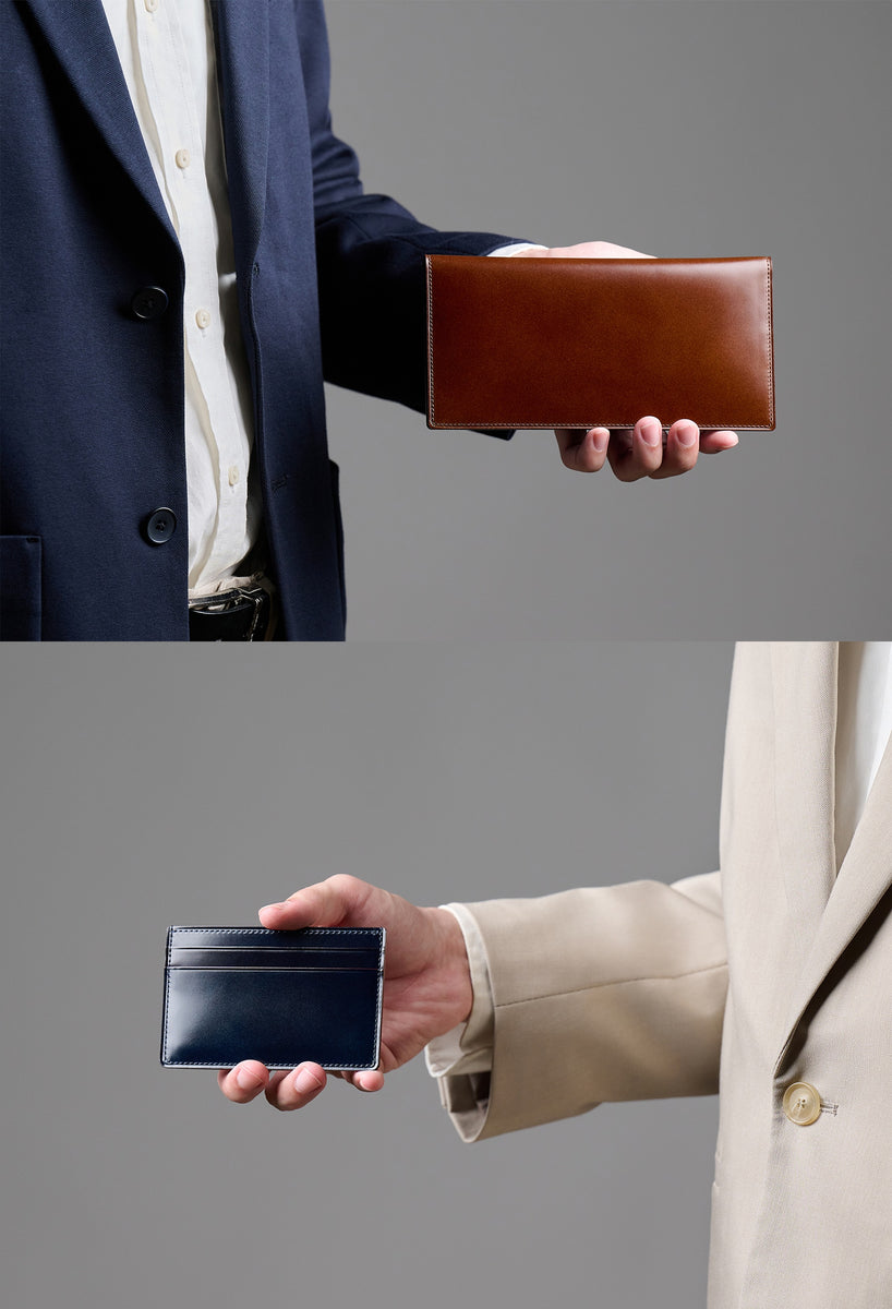 The image is a vertical diptych showing two close-up shots of hands holding Tsuchiya Kaban's cordovan leather accessories against a plain dark background.