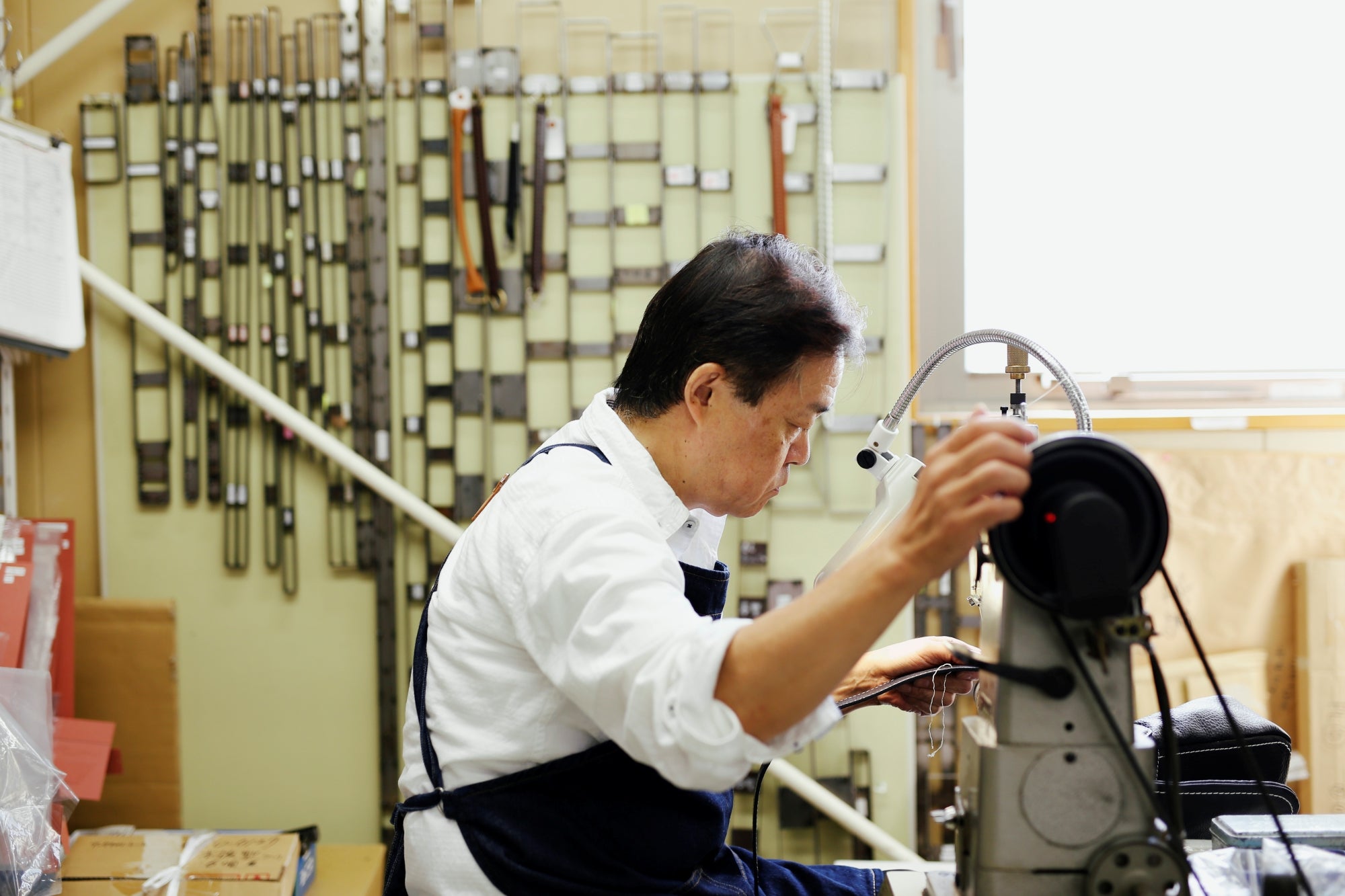 Person working on a machine in a workshop setting