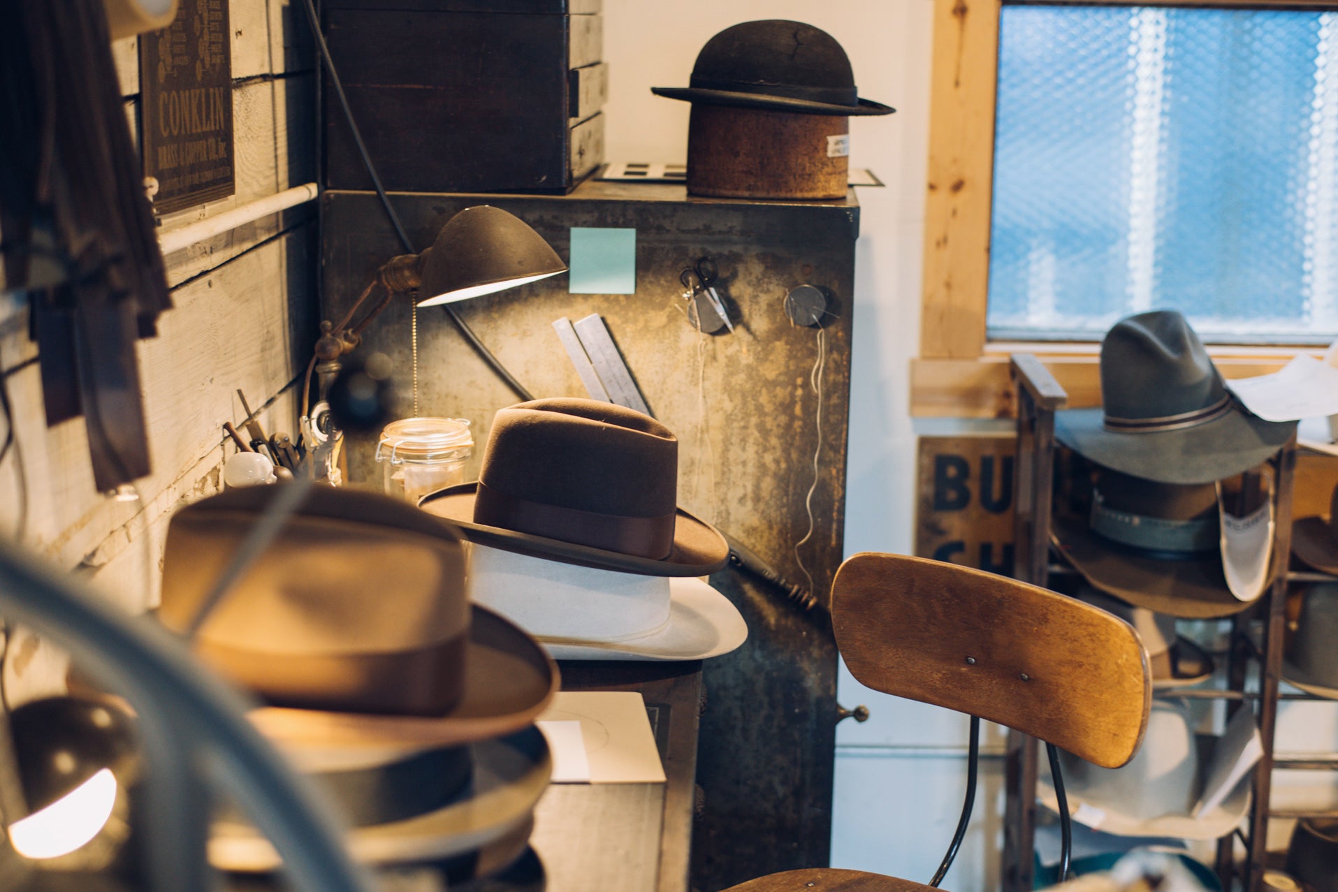 Photos of the inside of The Folklore Hat Co., a hat store in Portland